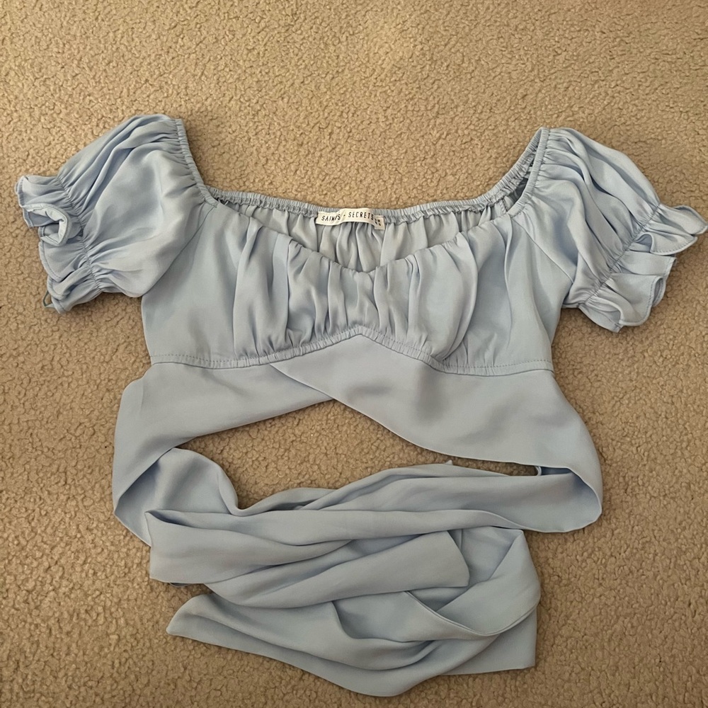 Light Blue Cropped Going-Out Top. Bow in the back. Size small.